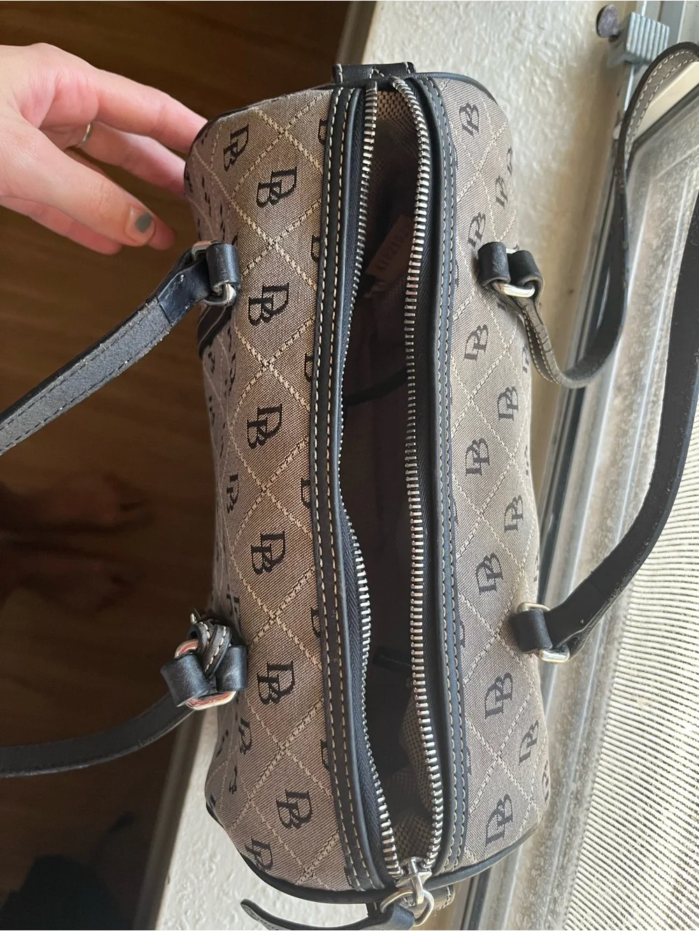 Dooney & Bourke Beige and Black Monogram Barrel Bag with Charm